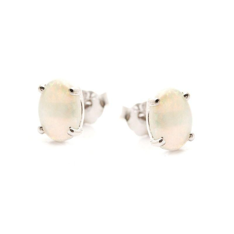 Stud earrings with natural oval white opal, in 925 rhodium silver