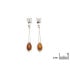 Lange oorbellen met natuurlijk cognac-amber, in gerhodineerd zilver 925