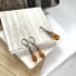 Oorbellen met natuurlijk cognac-amber, in gerhodineerd zilver 925