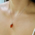 Pendant with irregular cognac amber, in 925 rhodium silver, height 2.5 cm