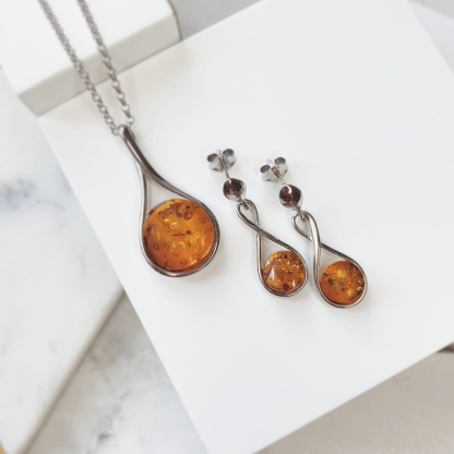 Boucles d'oreilles pendantes avec ambre cognac rond, en argent rhodié 925