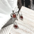 Levensbloem oorbellen met natuurlijk cognac amber, in 925 gerhodineerd zilver
