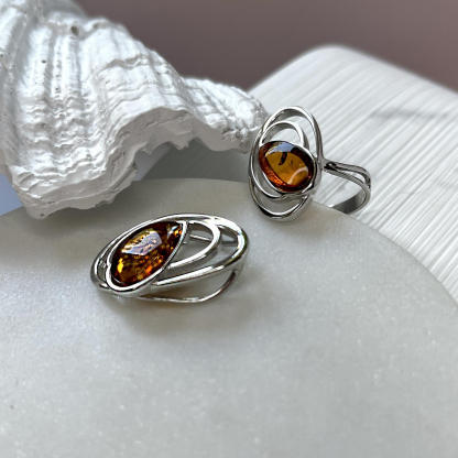 Pendant with oval cognac amber, in 925 rhodium silver, height 2.5 cm