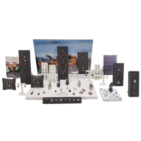 Jewelry kit with natural stones and displays for implantation