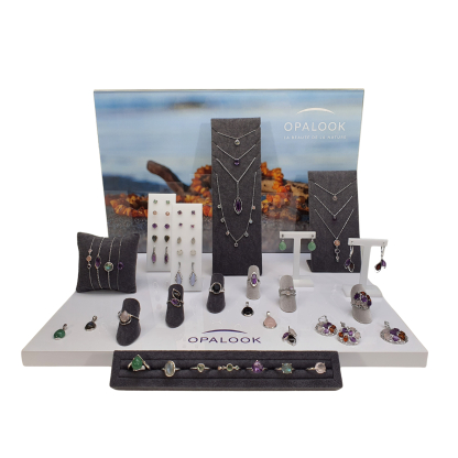 Jewelry kit with natural stones and displays for implantation