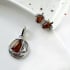 Baltische barnsteenhanger schip cognac onregelmatig, gerhodineerd 925 zilver