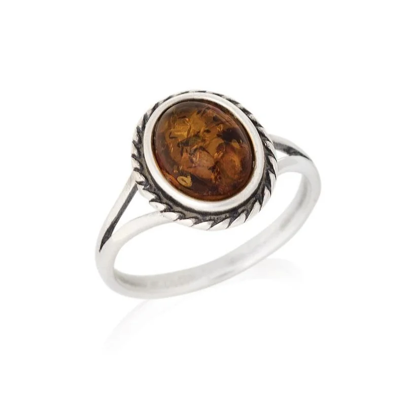 Ring with oval Baltic Sea cognac amber, in 925 antique silver