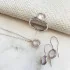 Earrings with round natural rose quartz, in 925 rhodium silver