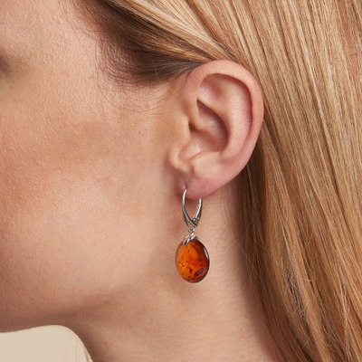 Wholesaler of jewelry and accessories - Dangle earrings with round cognac amber, in rhodium-plated silver 925/1000
