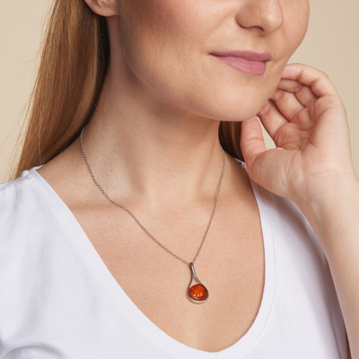 Wholesaler of jewelry and accessories - Necklace with natural cognac amber from the Baltic Sea round, in rhodium silver 925/1000